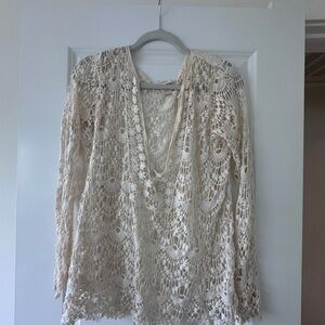 Cream crochet blouse with a boho vibe